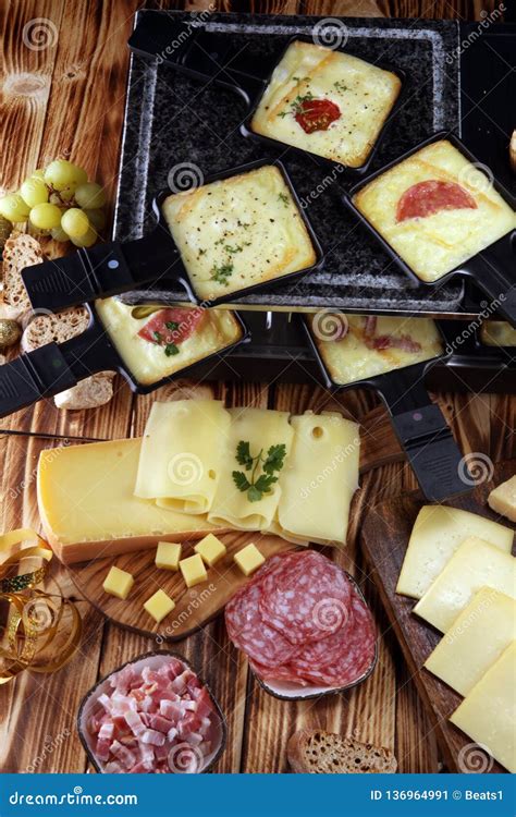 Delicious Traditional Swiss Melted Raclette Cheese Served in Individual ...