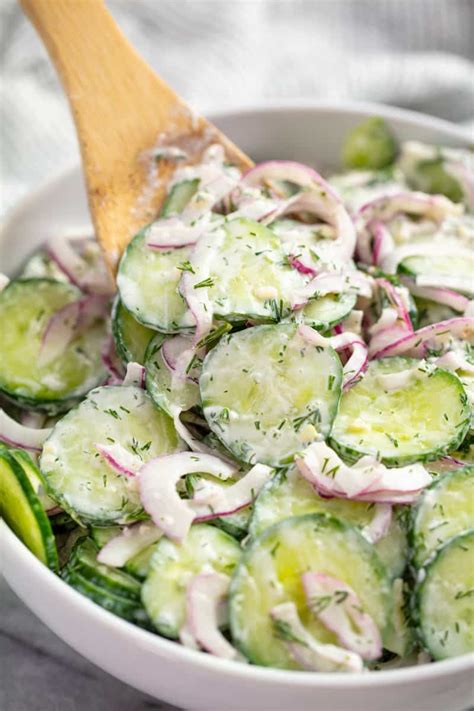 This Creamy Cucumber Salad recipe is a classic family favorite recipe. Thinly sliced cucumbers ...