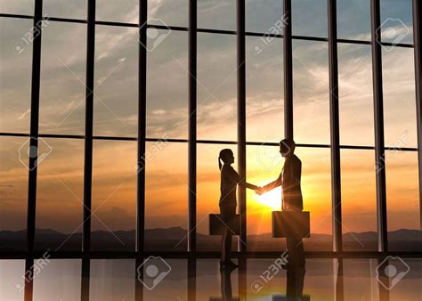 Two Business shake hand silhouettes rendered with computer graphic , # ...