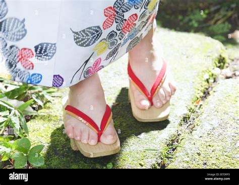 Woman wearing Japanese wooden clogs Stock Photo - Alamy