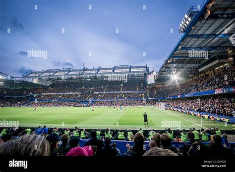 People watching a match at the Stamford Bridge football stadium, which ...