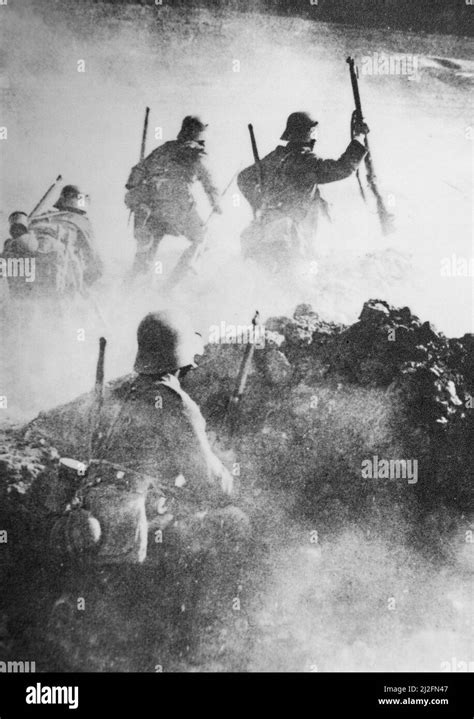 German WWI stormtroopers advance through clouds of smoke towards enemy positions on the Western ...