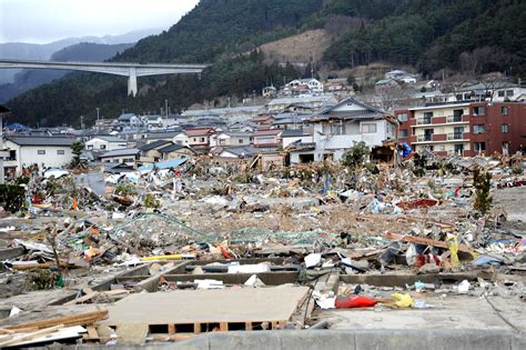 Rows of homes lie in splinters as part of the tsunami aftermath in the coastal city of Misawa ...