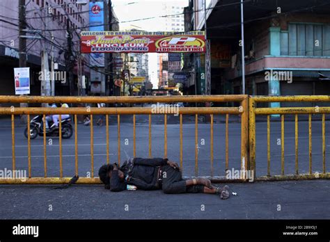 Manila, Philippines. 25th Mar, 2020. A homeless man sleeps on the ...