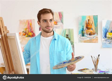 Young male artist painting Stock Photo by ©belchonock 134835208