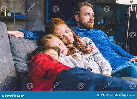 Family relaxing on sofa stock photo. Image of male, brother - 106216618