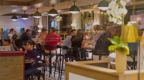 people are sitting at tables in a restaurant