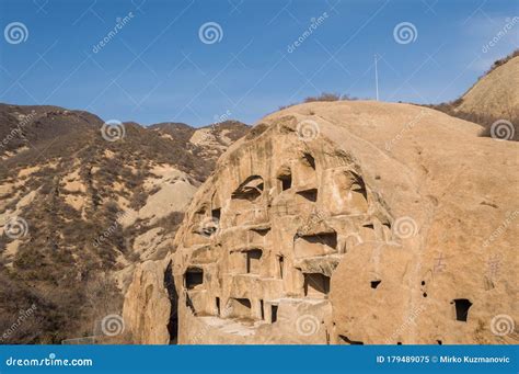 Ancient Cliff Dwellings Of Guyaju Caves In China Royalty-Free Stock ...