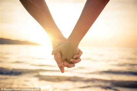 Holding hands with your partner can help ease their pain | Daily Mail ...