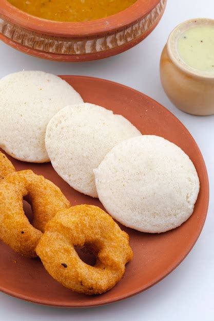 Premium Photo | South indian popular breakfast idli, vada, sambar or ...