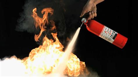 Slow Motion Fire Extinguisher Putting Out Flames with Slow Mo HD Video View of Dry Powder on ...