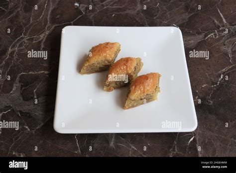 Baklava is a layered pastry dessert made of filo pastry, filled with ...