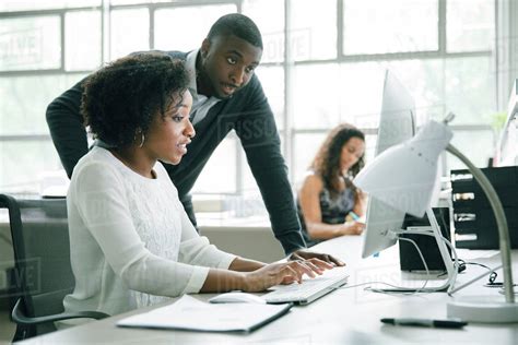 People who use computers at work in a office - wonderhooli