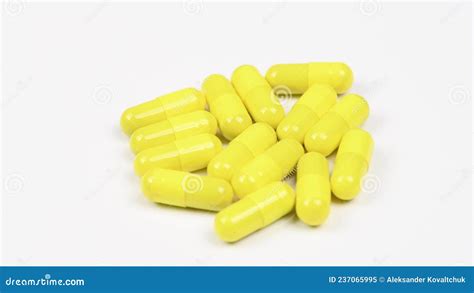 Yellow Capsules on White Background. Side View. Loop Motion. Rotation 360 Stock Video - Video of ...