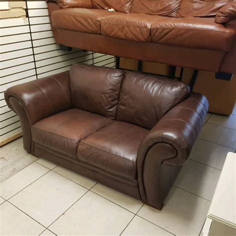 2 seater sofa in a heavy grade of brown leather Hyde - Whelans Quality Used Furniture