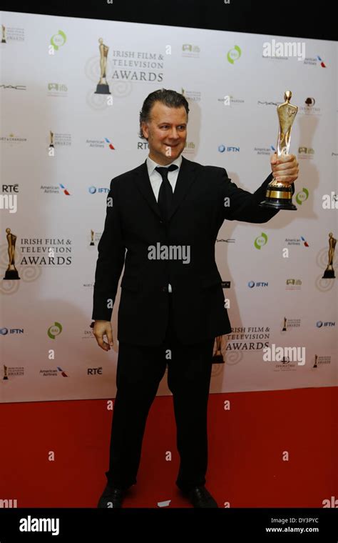 Dublin, Ireland. 5th April 2014. Irish director Ian Fitzgibbon presents his IFTA award for Best ...