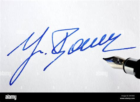 Handwritten signature with pen on a letter Stock Photo - Alamy