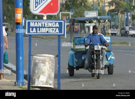 Motoconcho dominican motorcycle taxi driver in Samana Dominican Republic Stock Photo - Alamy