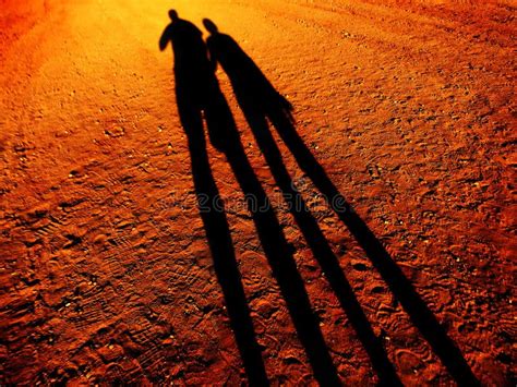 Shadow of People Holding Hands Walking on Pathway Stock Photo - Image ...