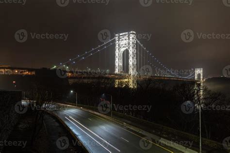 George Washington Bridge fully illuminated at night from New York City ...