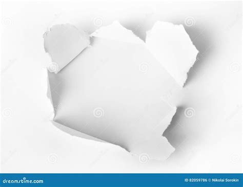 Hole punched in the paper stock photo. Image of circle - 82059786