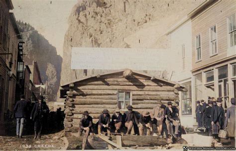 View of log cabin being consumed by progress at Creede, Colorado (colorized) – Western Mining ...