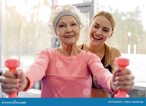 Cheerful Grandmother Making Exercises in Gym Stock Image - Image of apartment, lady: 91206223