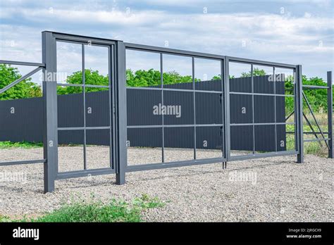 Installation of metal gates Stock Photo - Alamy