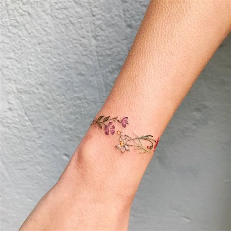 Floral wristband tattoo.