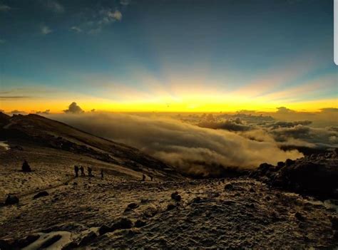 Sunrise from the peak of Mount Kilimanjaro Tanzania Africa | Mount kilimanjaro, Kilimanjaro ...