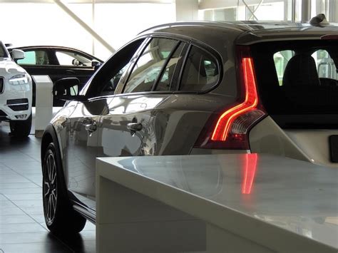 Premium Photo | Unsold vehicles in a showroom of a car retailer