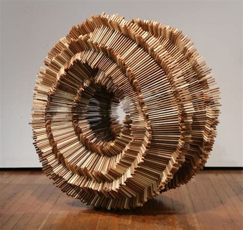 Hundreds of Pieces of Stacked Wood Form Beautifully Organic Sculptures