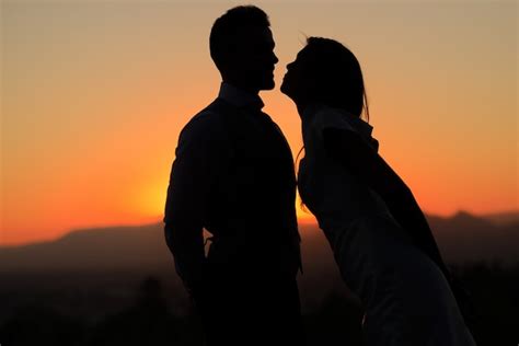 Free Photo | Silhouette of married couple at sunset