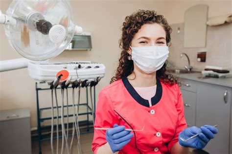 Premium Photo | Portrait of young female dentist in office.