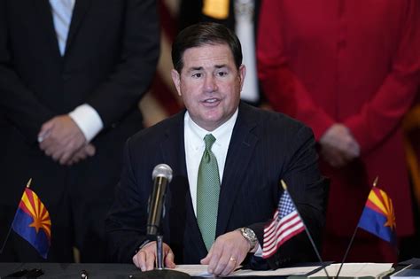 Arizona governor signs a lineup of Covid-19 and election reform bills ...