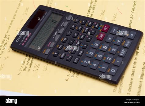 Scientific calculator on student school work Stock Photo - Alamy