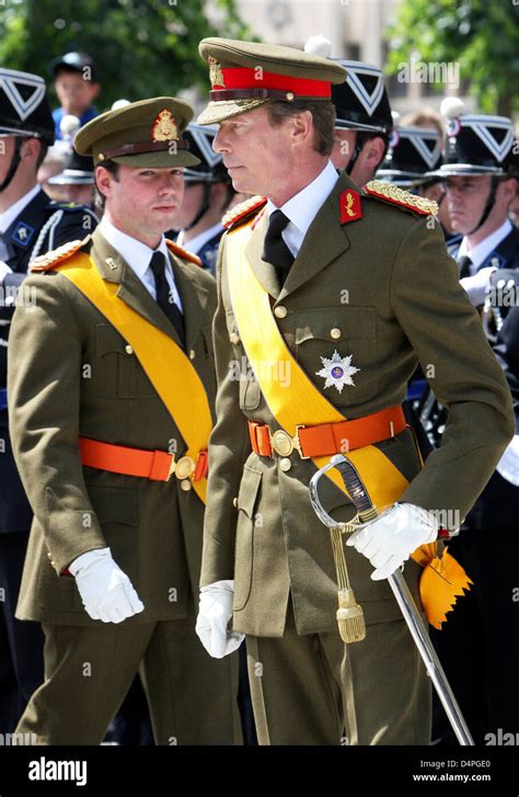 Henri Grand Duke of Luexmbourg (R) and Prince Guillaume of Luxembourg watch a prarade on the ...