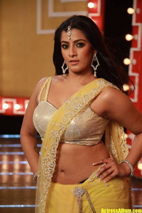 Varalaxmi Sarathkumar Navel Hip Show Photos From Tamil Movie In Yellow ...