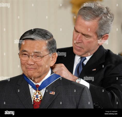 U.S. President George W. Bush awards Norman Y. Mineta the Presidential ...