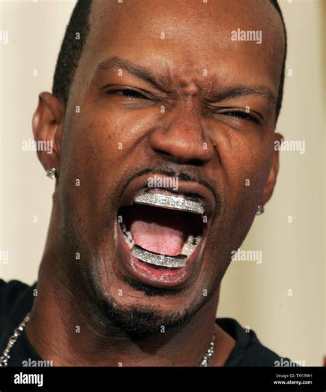 Jordan "Juicy J" Houston shows off his diamond-studded teeth at the ...