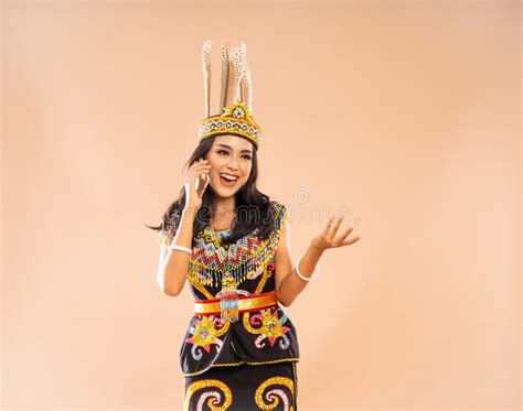 Woman in Traditional Clothes of Dayak Tribe Calling Using the Phone Stock Photo - Image of king ...