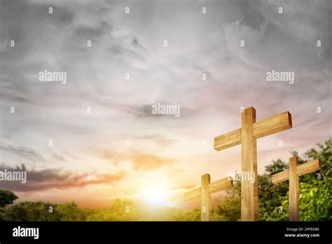 Christian Cross with sunset sky background Stock Photo - Alamy