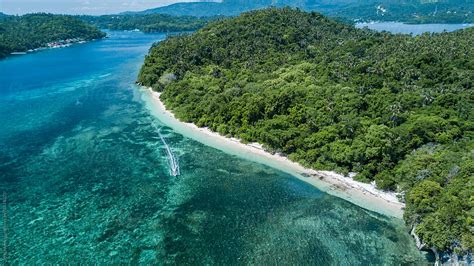 "Top View Aerial Shot Of Tropical Rock Island And A Boat Moving" by ...