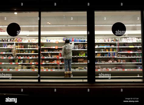 Supermarket at night photographed from outside Stock Photo - Alamy