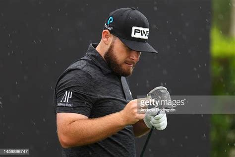 Tyrell Hatton of England inspects their golf club during Day Two of ...