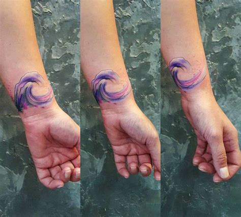 Watercolor wave tattoo on the wrist - Tattoogrid.net