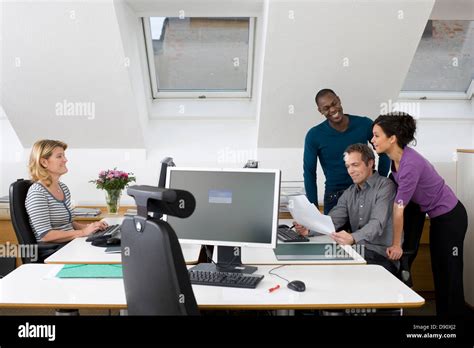 People working together in office Stock Photo - Alamy