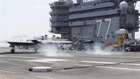 X-47B: first ever unmanned carrier landing - YouTube