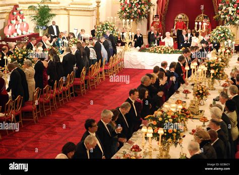 Queen Elizabeth II and South African President Jacob Zuma enjoy a toast ...