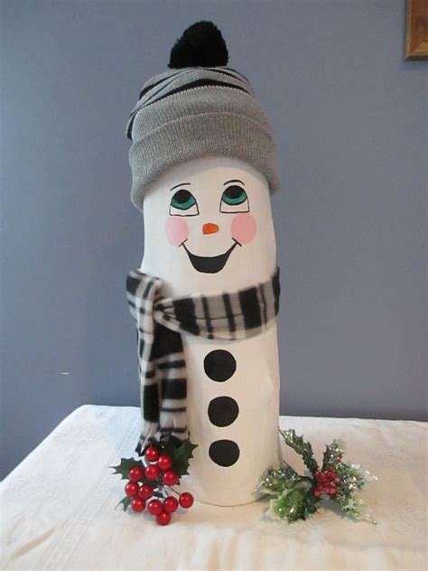 This Happy Snowman Log is newly handcrafted and hand painted and is made entirely of tree logs ...